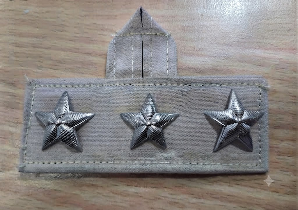 JERARQUIA PECTORAL COLGANTE GRIS ARENA OFICIAL